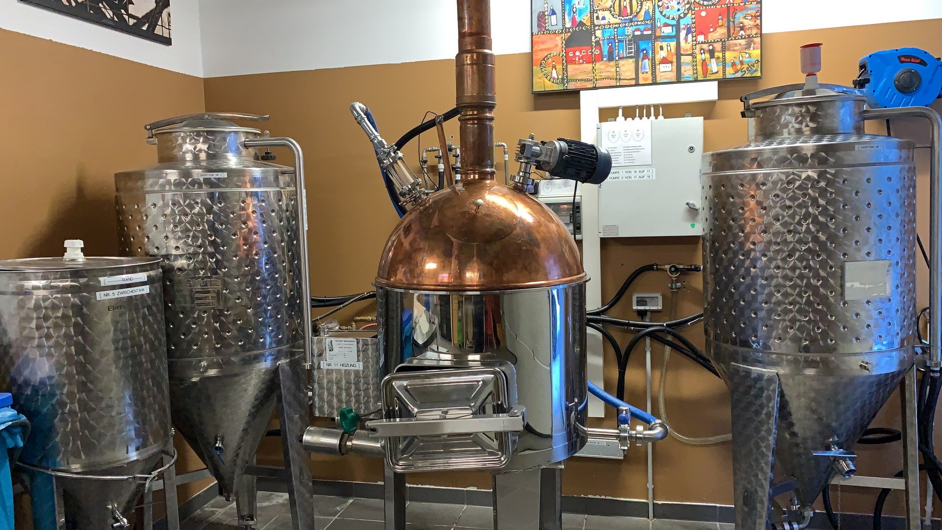 The Gratznbräu brewery Distillation apparatus and stainless steel tanks in a small distillery